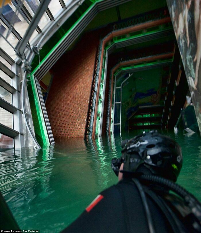 Diver inside the capsized wreck of the Costa Concordia. Submechanophobia.