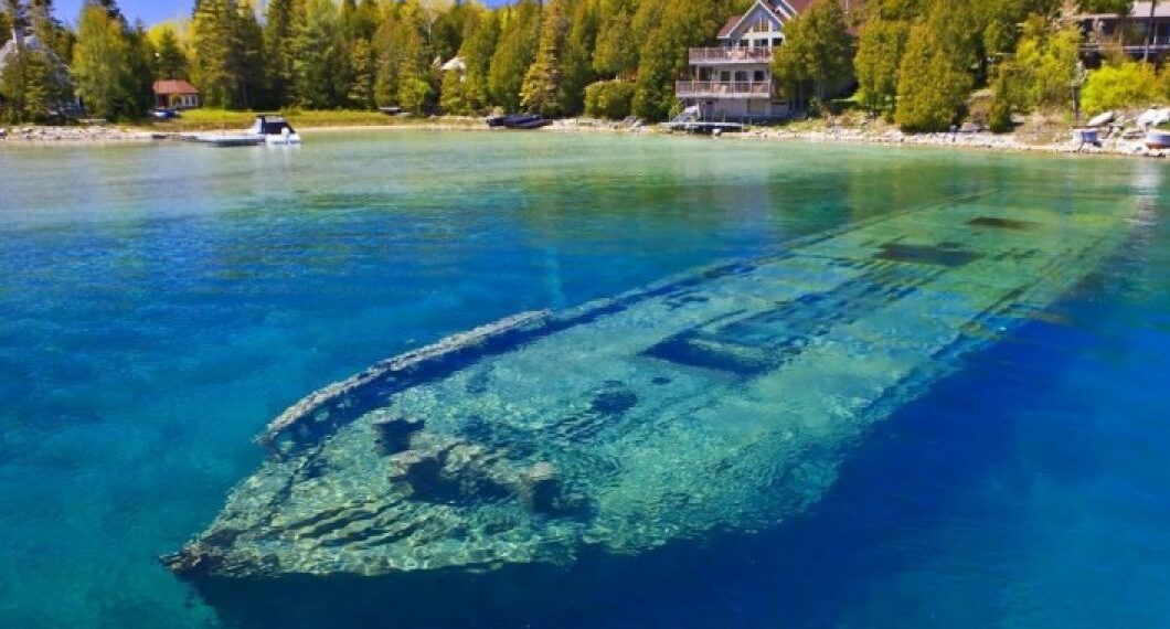 Submechnophobia causing ship wreck showing through water.