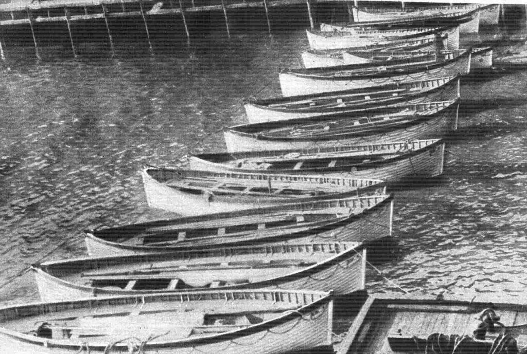 Recovered Titanic lifeboats lined up in New York. 